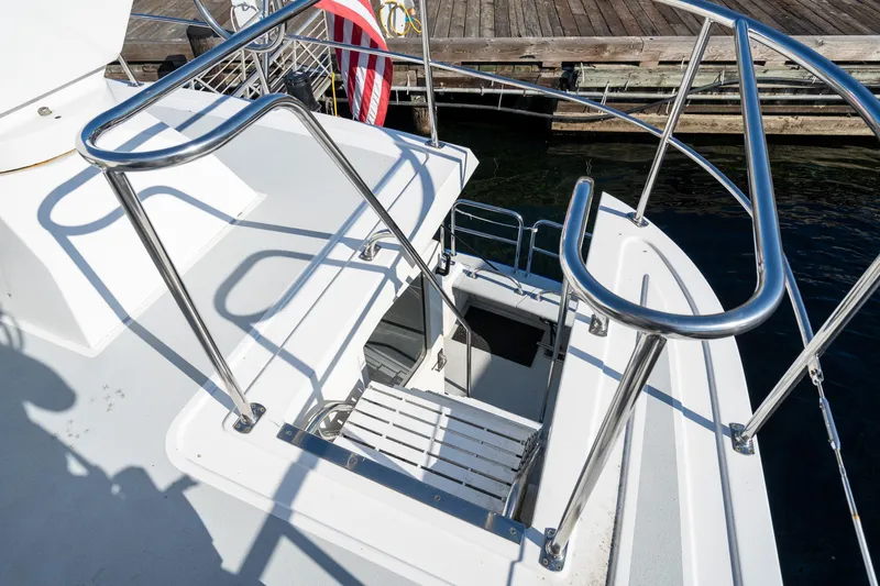Slide: The Image of 1998 Northern Marine Trawler deck with stainless steel railings and open hatch. - 42