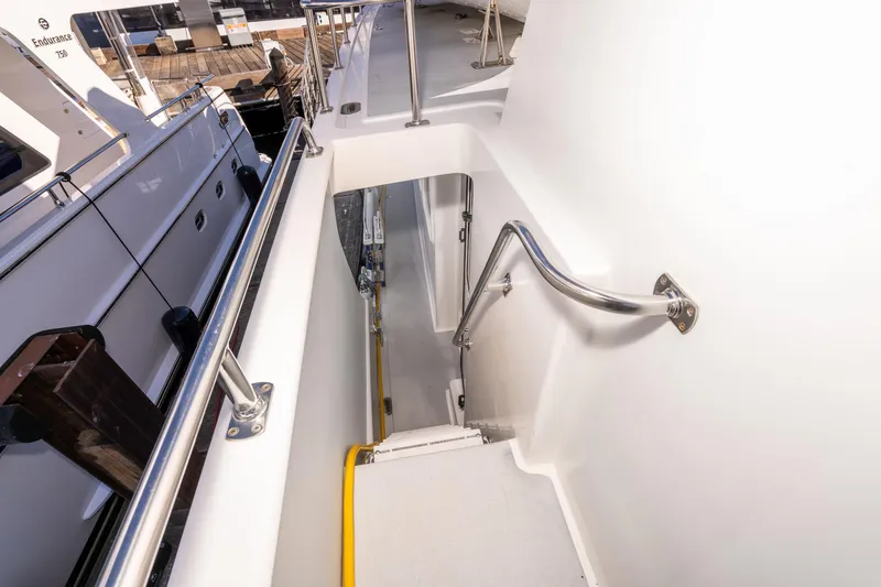 Slide: The Image of Stairway on 1998 Northern Marine Trawler with stainless steel handrails and white deck. - 58