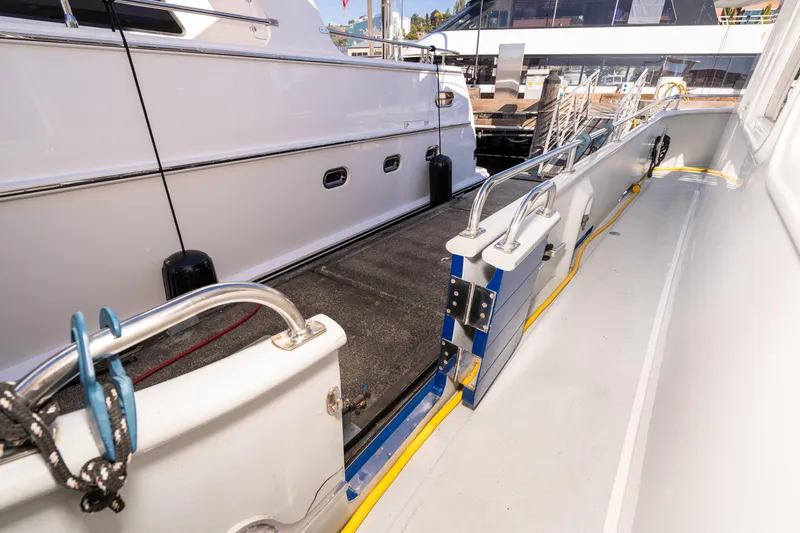 Slide: The Image of 1998 Northern Marine Trawler docked, showcasing side deck and railing details. - 6