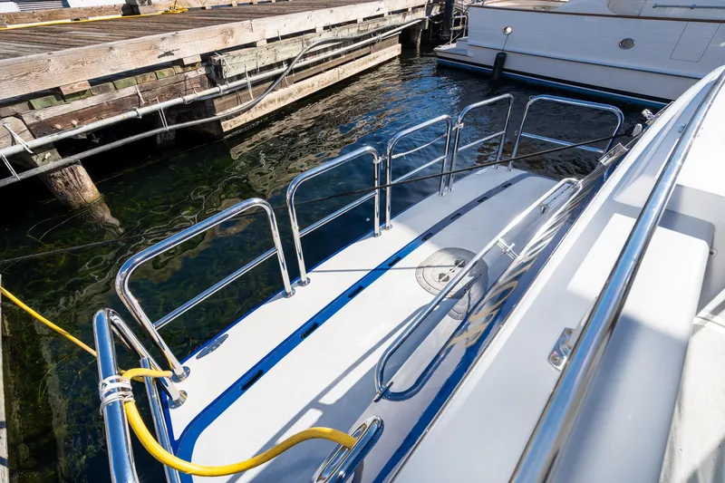 Slide: The Image of 1998 Northern Marine Trawler docked, featuring polished railings and a clean deck. - 62