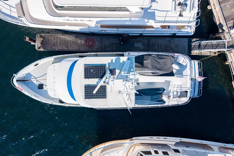 Slide: The Image of Overhead view of a 1998 Northern Marine Trawler docked, featuring solar panels. - 70
