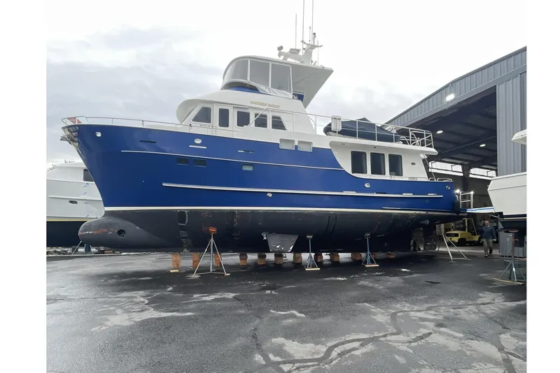 Slide: The Image of 1998 Northern Marine Trawler in dry dock, blue hull, ready for maintenance. - 80