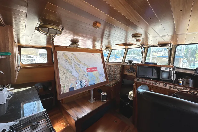 Slide: The Image of Pilothouse of 2002 Carlson Marine Trawler with navigation map and control panel. - 21