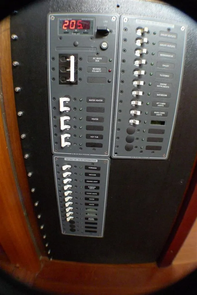 Slide: The Image of Electrical control panel on a 2002 Carlson Marine Trawler boat. - 54