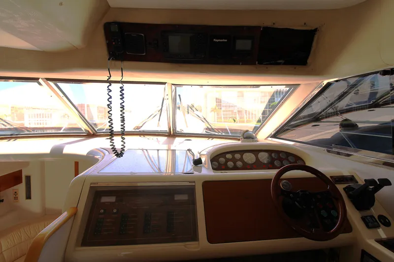 Slide: The Image of Interior view of 1997 Viking Sport Cruisers 48SC helm with steering wheel and control panel. - 10