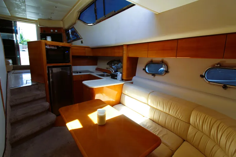 Slide: The Image of Interior of 1997 Viking Sport Cruisers 48SC yacht with kitchen and seating area. - 11