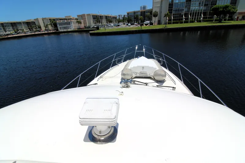 Slide: The Image of Bow view of 1997 Viking Sport Cruisers 48SC yacht on calm water. - 21