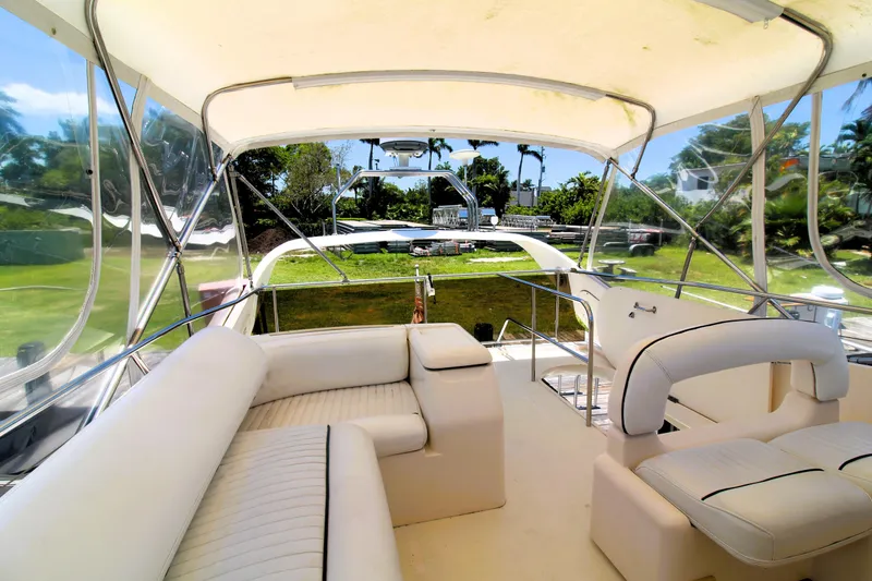 Slide: The Image of Luxurious 1997 Viking Sport Cruisers 48SC yacht interior with plush seating and scenic views. - 3