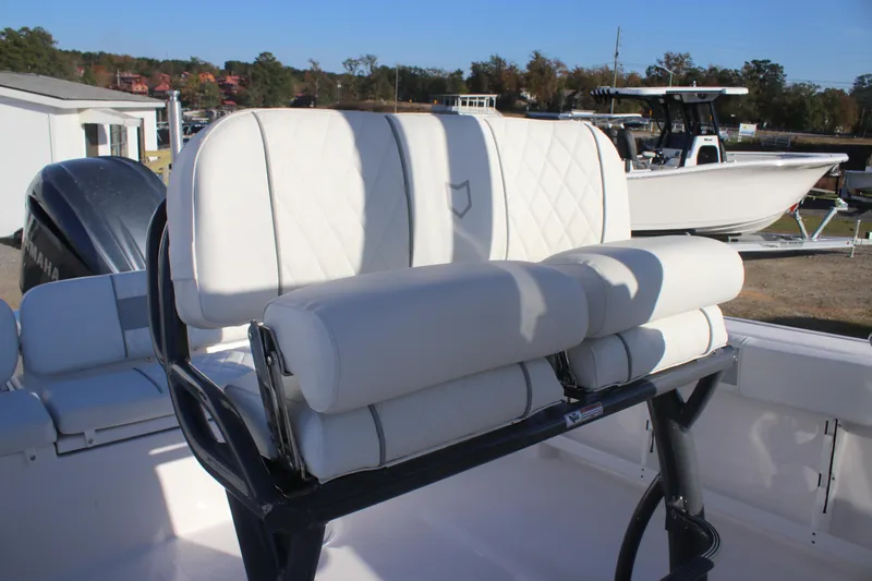 Slide: The Image of 2025 Sea Fox 248 Commander boat with white cushioned seating and sleek design. - 13