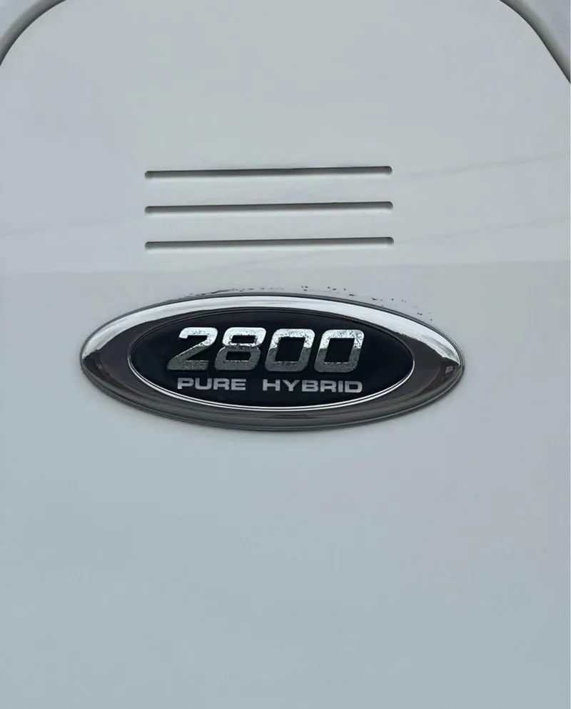 Slide: The Image of 2019 Blue Wave 2800 Pure Bay boat emblem, displaying "2800 Pure Hybrid" text. - 18