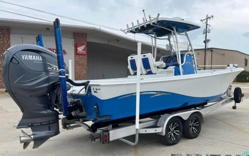 Slide: The Image of 2019 Blue Wave 2800 Pure Bay boat with Yamaha engine on trailer. - 3