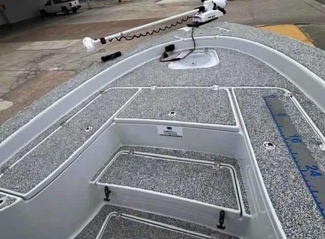 Slide: The Image of 2019 Blue Wave 2800 Pure Bay boat deck with storage compartments and measuring ruler. - 6