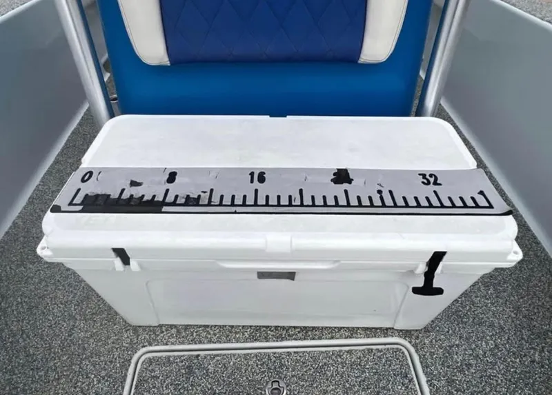 Slide: The Image of White cooler with measuring scale on a 2019 Blue Wave 2800 Pure Bay boat. - 9