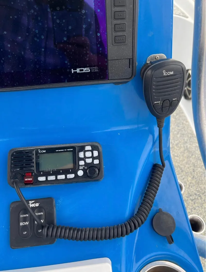 Slide: The Image of Control panel of a 2019 Blue Wave 2800 Pure Bay boat with Icom radio equipment. - 14