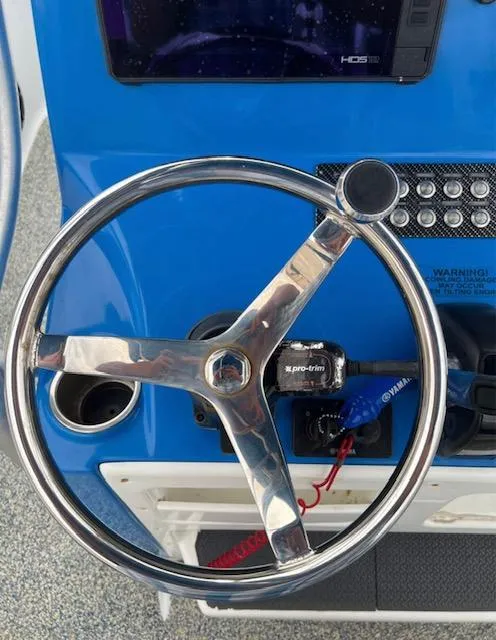 Slide: The Image of Steering wheel of a 2019 Blue Wave 2800 Pure Bay boat. - 16