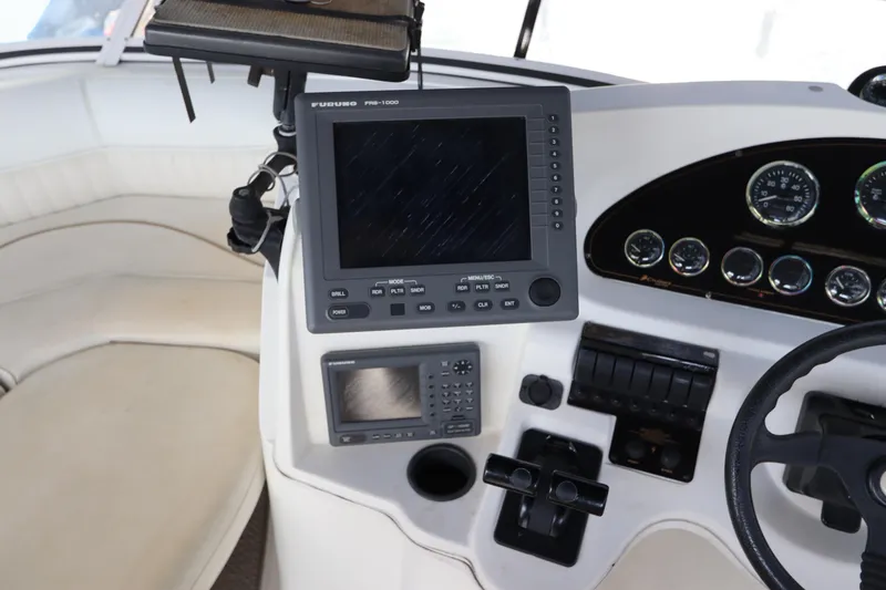 Slide: The Image of 1999 Cruisers Yachts 3750 Motoryacht helm with navigation equipment and gauges. - 22