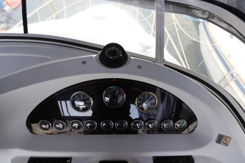 Slide: The Image of 1999 Cruisers Yachts 3750 Motoryacht dashboard with gauges and controls. - 23