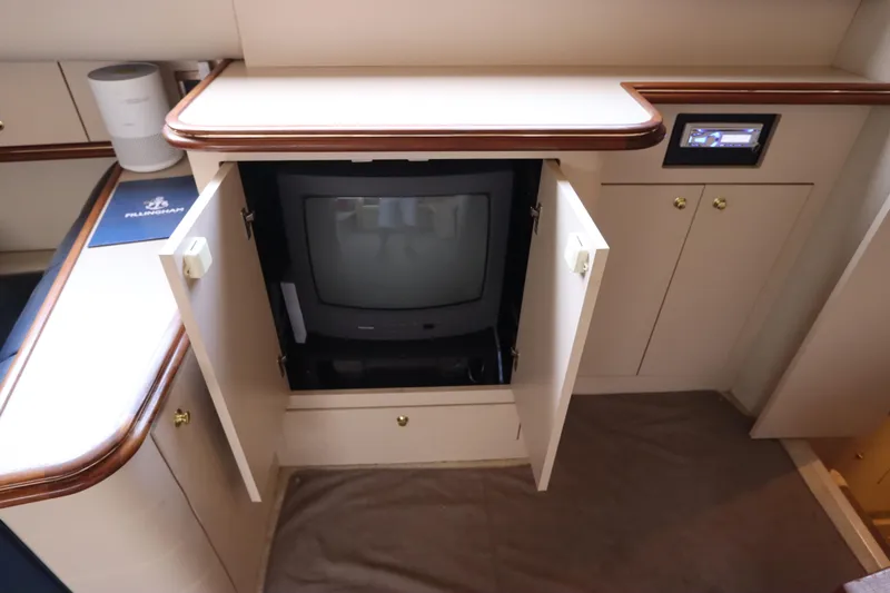 Slide: The Image of 1999 Cruisers Yachts 3750 Motoryacht interior with vintage TV in cabinet. - 27