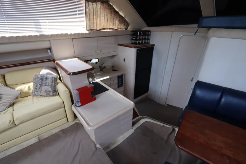 Slide: The Image of Interior of 1999 Cruisers Yachts 3750 Motoryacht with seating and kitchenette. - 29