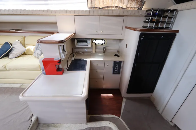 Slide: The Image of 1999 Cruisers Yachts 3750 Motoryacht interior kitchen with modern appliances and cabinetry. - 30