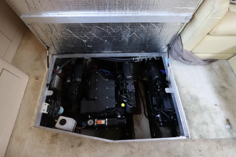 Slide: The Image of Engine compartment of 1999 Cruisers Yachts 3750 Motoryacht, showcasing dual engines. - 49