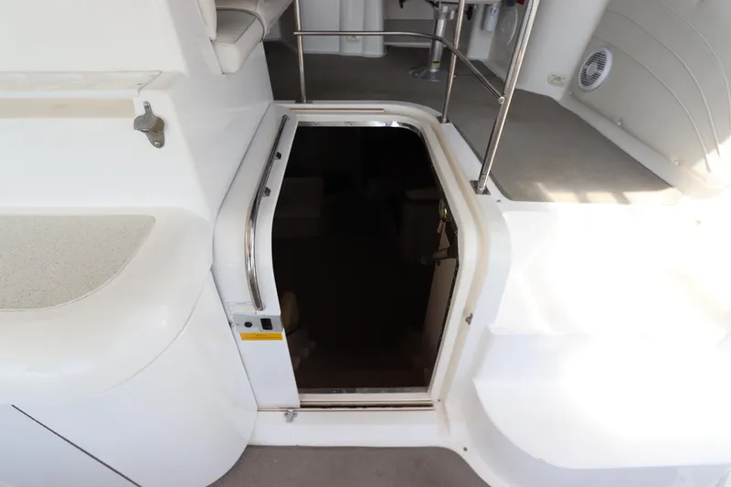 Slide: The Image of 1999 Cruisers Yachts 3750 Motoryacht interior entrance with stairs and seating area. - 24