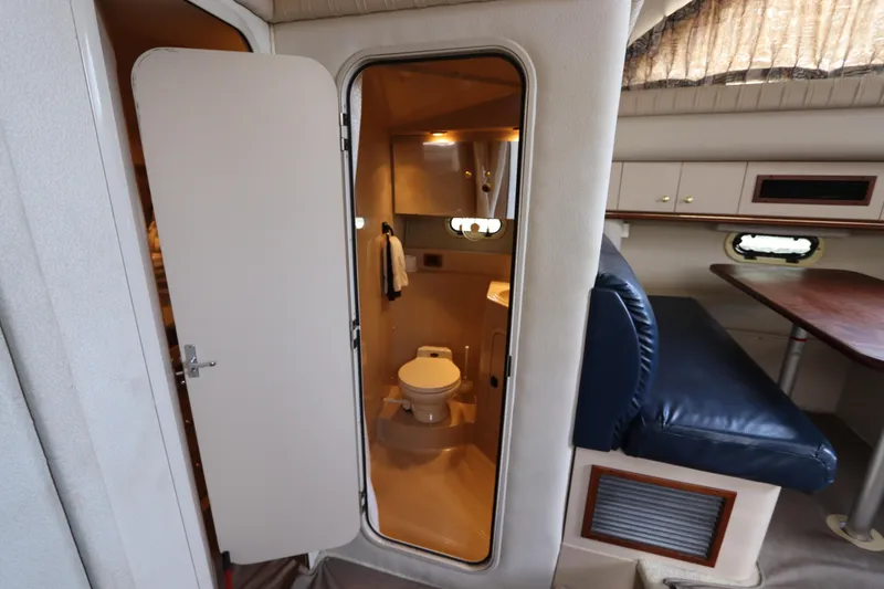Slide: The Image of 1999 Cruisers Yachts 3750 Motoryacht interior with bathroom and seating area. - 36