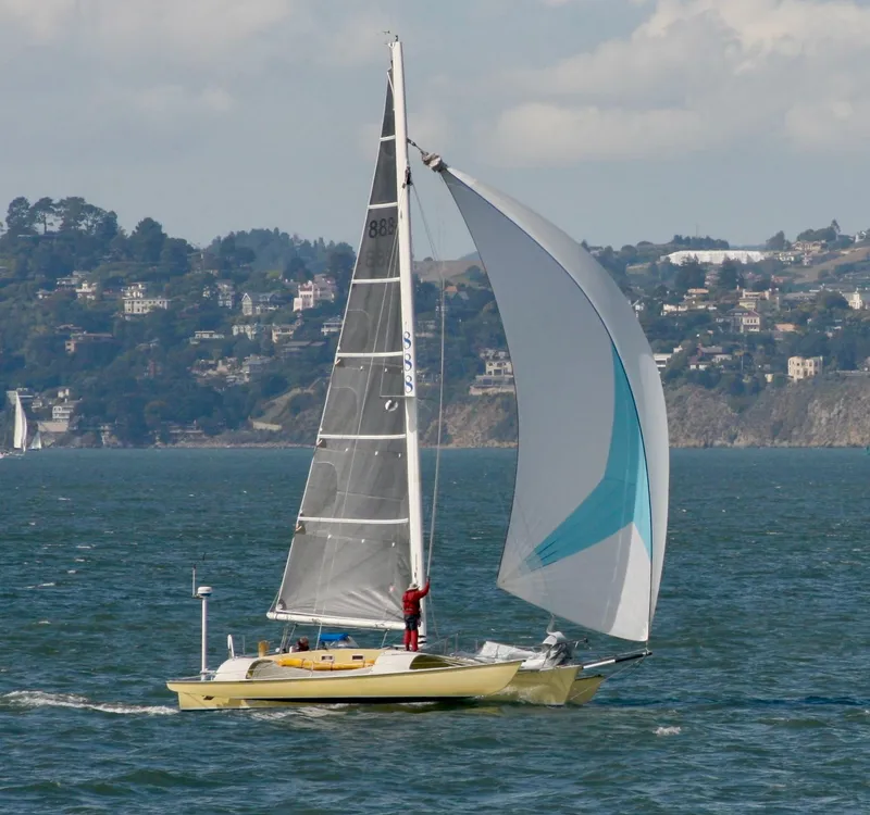 The Image of Sailing yacht Greene Marine 35 Acapella 1982 on open water with cityscape background. - 0