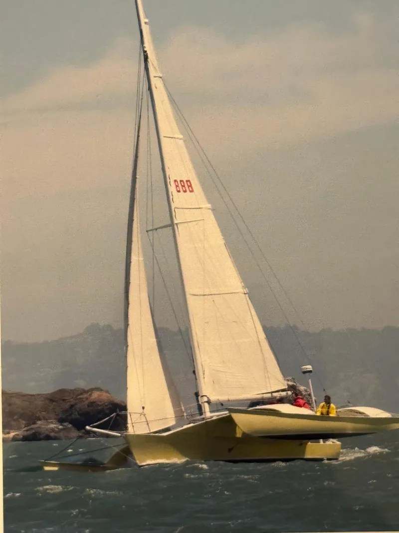 Slide: The Image of Sailboat "Greene Marine 35 Acapella" 1982 on water near bridge, sunny day. - 12