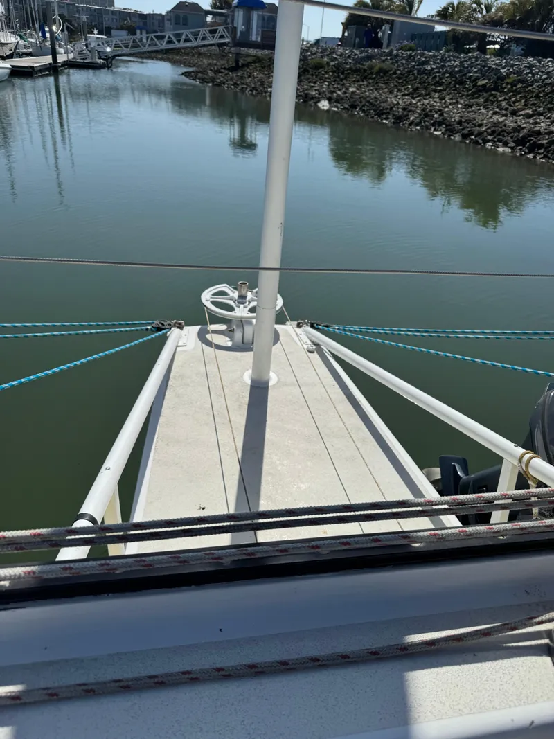 Slide: The Image of 1982 Greene Marine 35 Acapella sailboat docked in a calm marina. - 5