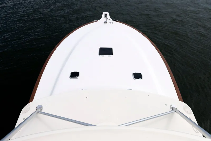 Slide: The Image of Bow view of 2002 Albemarle 41 Express Fisherman boat on calm water. - 10