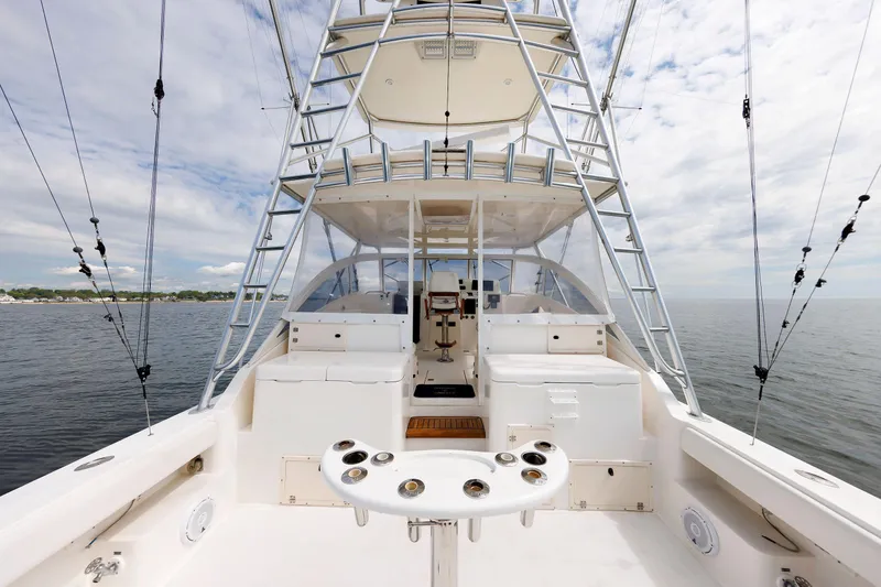 Slide: The Image of 2002 Albemarle 41 Express Fisherman boat with spacious deck and fishing equipment. - 11