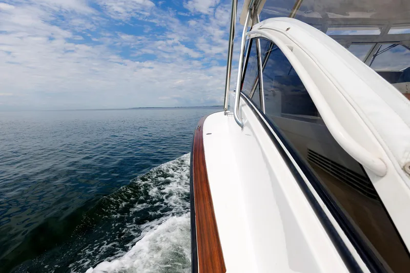 Slide: The Image of Albemarle 41 Express Fisherman boat cruising on open water, 2002 model. - 14