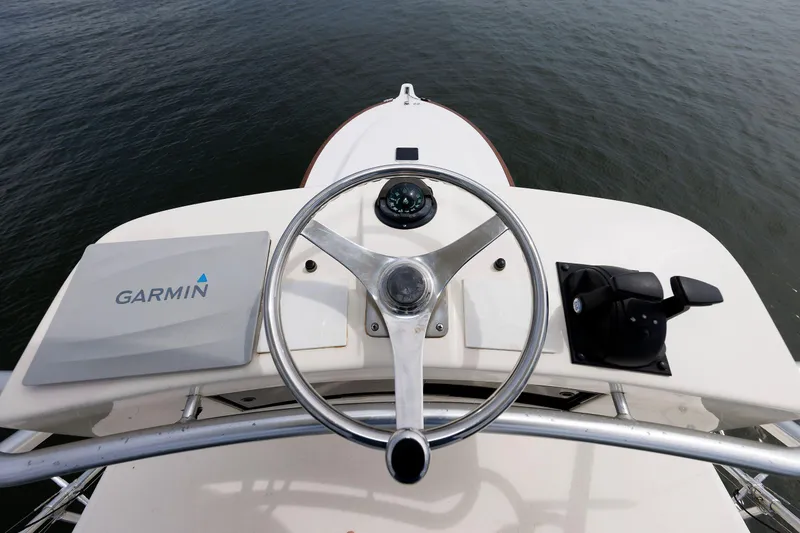 Slide: The Image of Steering wheel of 2002 Albemarle 41 Express Fisherman boat with Garmin navigation system. - 15