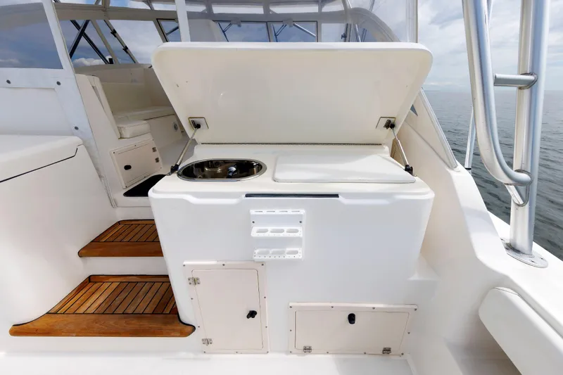 Slide: The Image of 2002 Albemarle 41 Express Fisherman boat interior with sink and storage compartments. - 19
