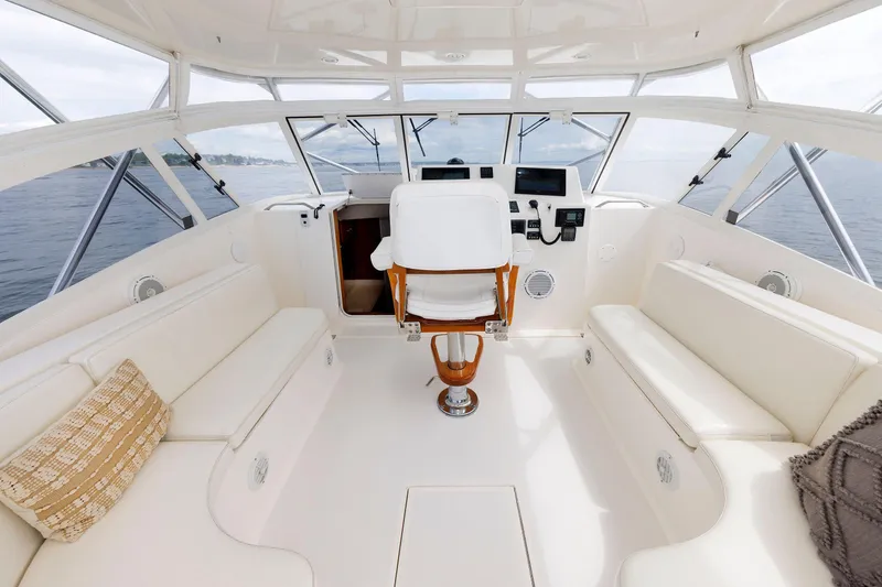 Slide: The Image of 2002 Albemarle 41 Express Fisherman boat interior with helm and seating area. - 22