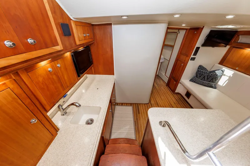 Slide: The Image of Interior of 2002 Albemarle 41 Express Fisherman with wood cabinetry and modern amenities. - 29