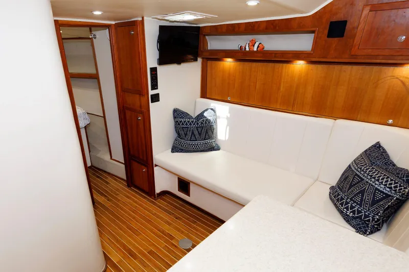 Slide: The Image of Interior of 2002 Albemarle 41 Express Fisherman with wood accents and white seating. - 30