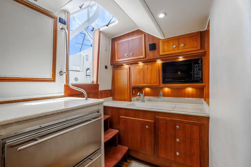 Slide: The Image of Interior of 2002 Albemarle 41 Express Fisherman with wooden cabinetry and modern amenities. - 34