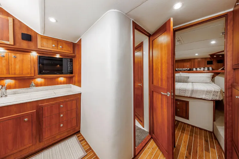 Slide: The Image of Interior of 2002 Albemarle 41 Express Fisherman with wood cabinetry and cozy bedroom. - 36