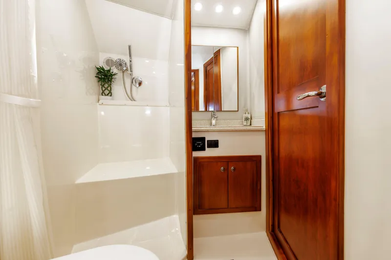 Slide: The Image of Luxurious bathroom interior of 2002 Albemarle 41 Express Fisherman yacht with wooden accents. - 37