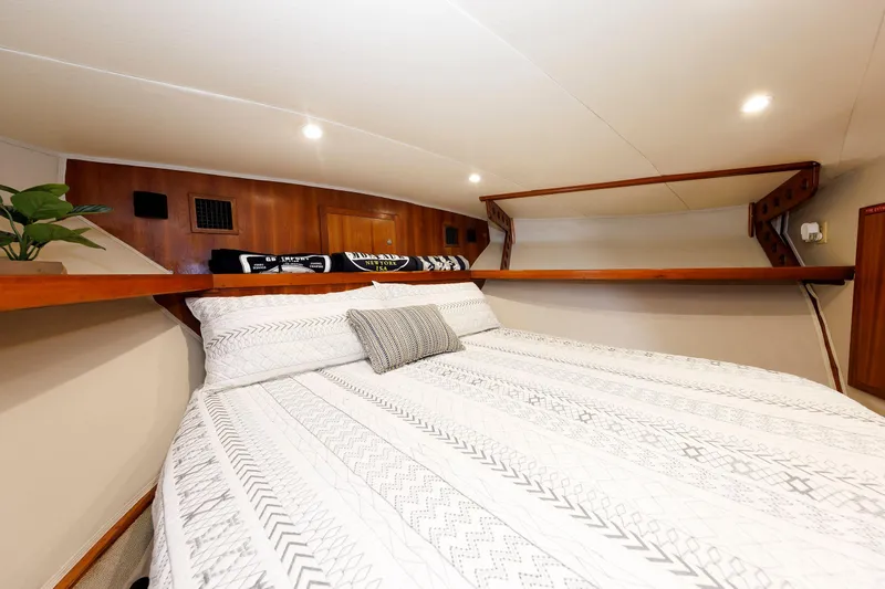 Slide: The Image of Luxurious cabin interior of 2002 Albemarle 41 Express Fisherman with cozy bedding. - 39