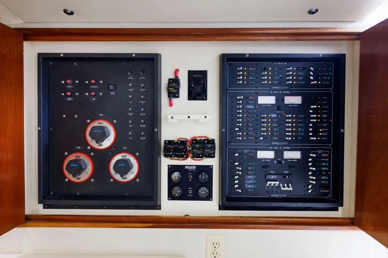 Slide: The Image of Electrical control panel of a 2002 Albemarle 41 Express Fisherman boat. - 42