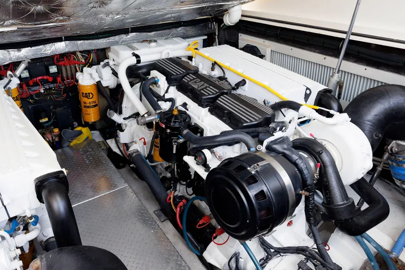 Slide: The Image of Engine room of a 2002 Albemarle 41 Express Fisherman boat, showcasing dual engines. - 44