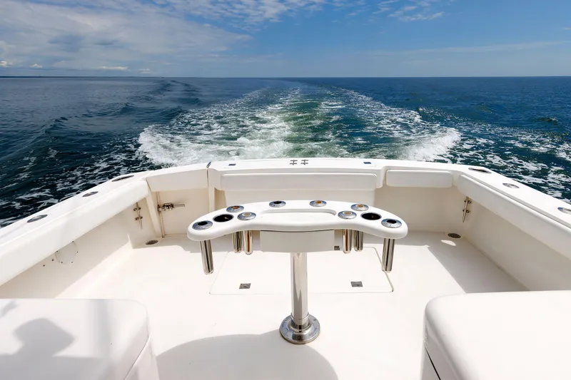 Slide: The Image of 2002 Albemarle 41 Express Fisherman boat cruising on open water. - 9