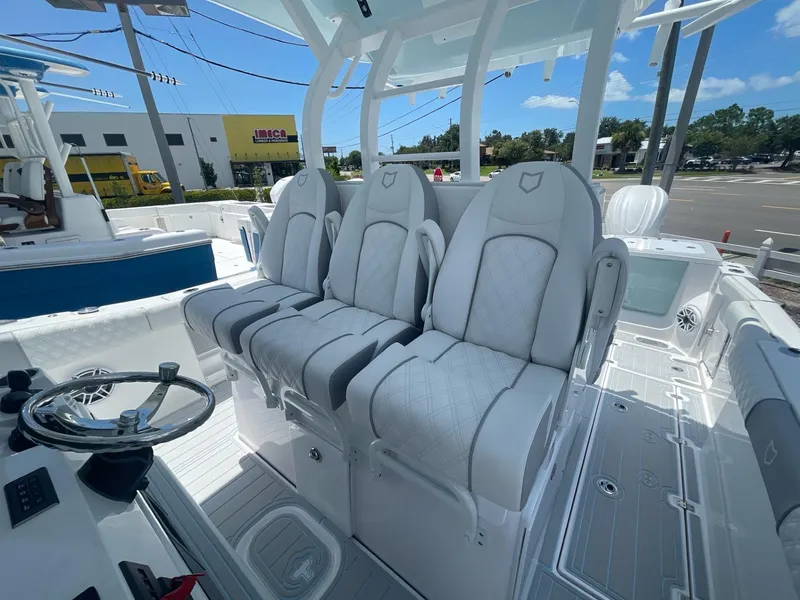 Slide: The Image of 2026 Sea Fox 368 Commander boat interior with luxurious seating and modern steering wheel. - 26