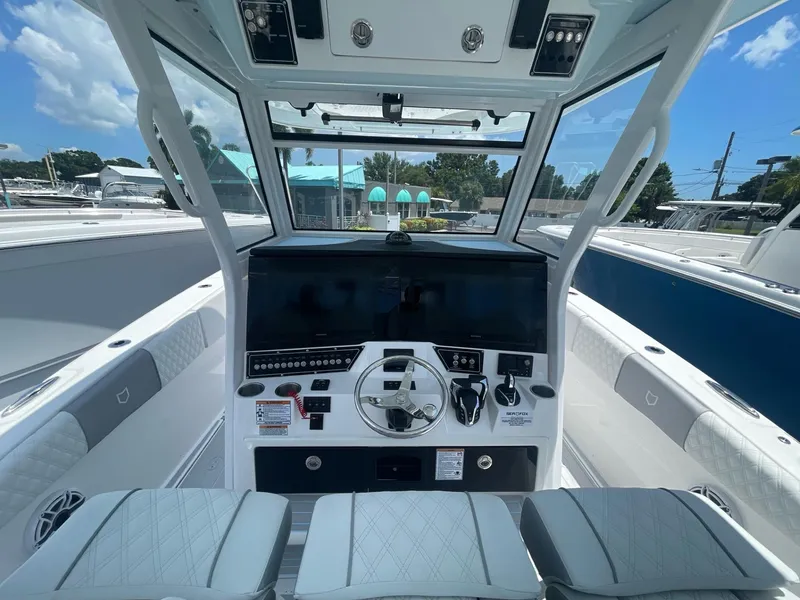 Slide: The Image of 2026 Sea Fox 368 Commander boat cockpit with modern controls and seating. - 27
