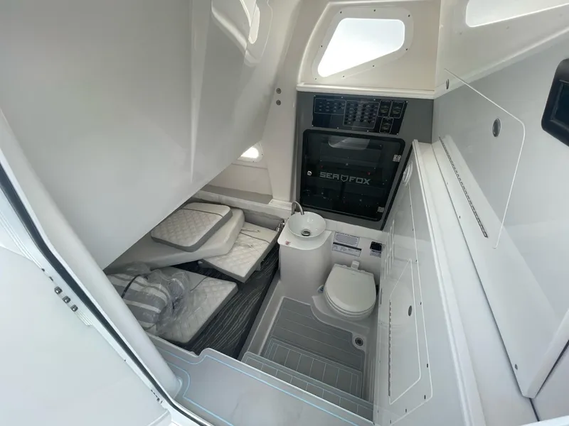 Slide: The Image of 2026 Sea Fox 368 Commander cabin interior with compact bathroom and sleeping area. - 30