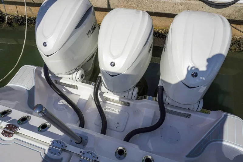Slide: The Image of Triple outboard engines on a 2026 Sea Fox 368 Commander boat at the dock. - 6