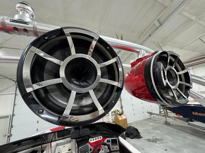 Slide: The Image of Close-up of speakers on a 2016 MasterCraft NXT22 boat in a garage setting. - 14